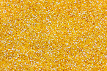 Pile of corn cereal close-up. Yellow corn cucumber, top view.