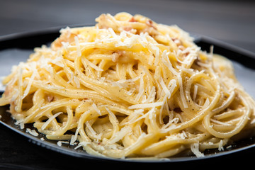 Spaghetti carbonara with egg and pancetta