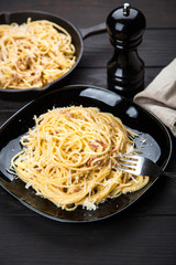 Spaghetti carbonara with egg and pancetta