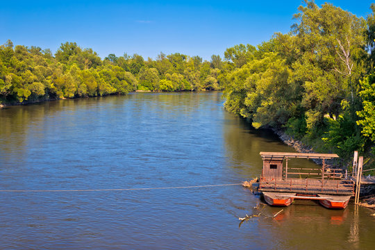 Mura river ferry boat and green landscape