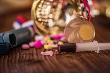 doping drugs pills injection needle inhaler in sport olympics championship competition trophy medal 