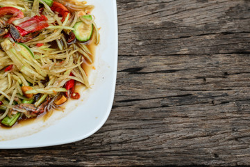 Thai food Papaya salad Spicy flavor On the old wood table