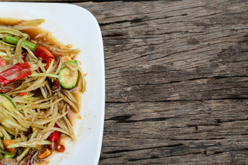 Thai food Papaya salad Spicy flavor On the old wood table