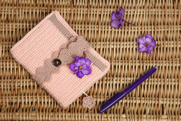 women's notebook and pen on the table