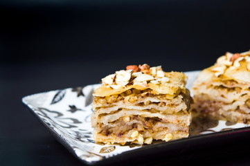 Baklava dessert slices on dark background