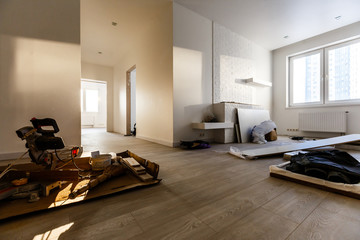 Unfinished building interior white room repairs in the apartment preparing in the room