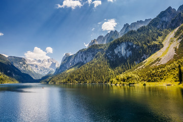 Fototapeta na wymiar Alpine lake Vorderer Gosausee. Salzkammergut is a famous resort area located in the Gosau Valley in Upper Austria. Dachstein glacier.