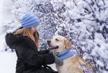 girl and dog in the winter park