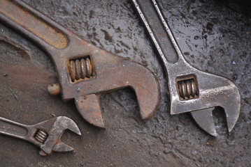 a set of old rusty adjustable wrench close up