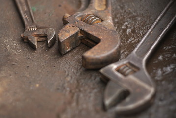 a set of old rusty adjustable wrench close up