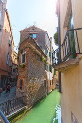 View of one of the many canals of Venice, Italy. Venice is a popular tourist destination of Europe.