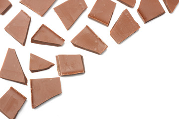 cracked chocolate candies sweets isolated on white background top view