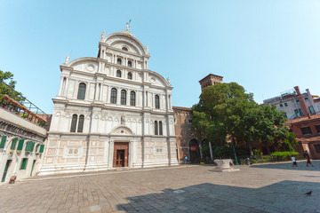One of the many square of Venice with a snow-white church in a traditional style, Italy. Venice is a popular tourist destination of Europe.