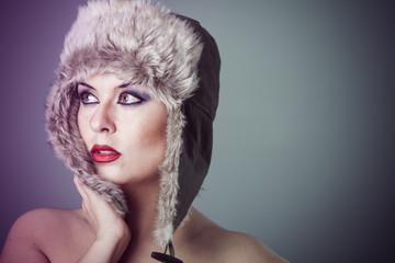 Ice, beautiful woman with fur hat, winter concept