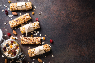 Granola bars on dark stone table. Top view.