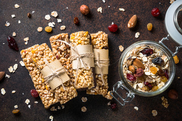 Granola bars on dark stone table. Top view.