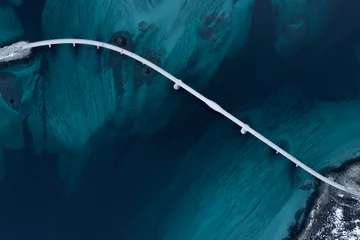 Foto op Canvas Luchtfoto van een brug over zeestraat. Zichtbare diepte met blauwe en groene kleuren in de buurt van Tromso. Sommaroy, Noorwegen © Zdenar Adamsen