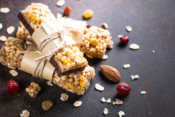 Granola bars on dark stone table. 