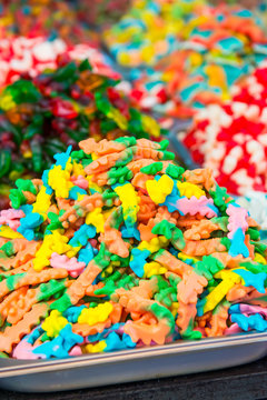 Close up view of assorted colorful different shape jelly candies on market place in Tel Aviv, Israel. Selective focus, space for text.