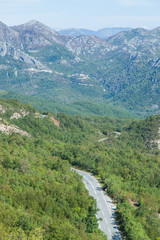 Fototapeta na wymiar View of the road in the valley between the mountains. Montenegro. 