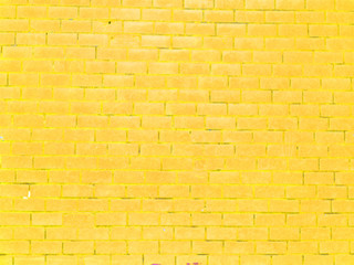 Old yellow brick wall background for spring or summer card or easter background