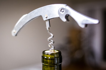 Wine opener with bottle of wine close up