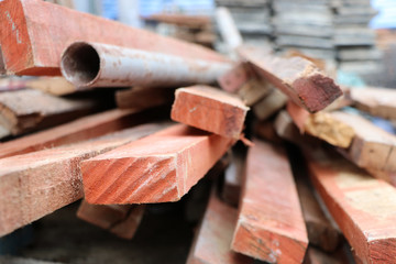 Wood and iron pipe construction works old and dirty after remove from building equipment pattern at constrution site