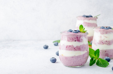 Acai berry yogurt in glass jars
