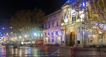 Fototapeta na wymiar New Year's illumination streets of Avignon at evening