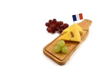 Cheese chopping board stock images. Cheese isolated on a white background. French cheese with grapes. Healthy snack images
