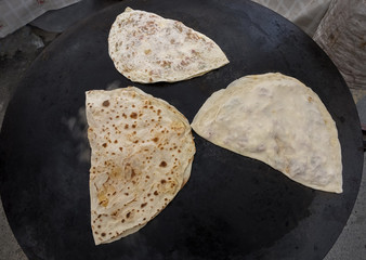 turkish gÃ¶zleme on the on sheet iron (turkish sac) ,closeup, Tu