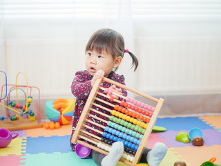 baby girl play abacus at home