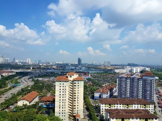 Naklejka premium High angle aerial view of Johor Bahru, Malaysia's cityscape of mixed development on sunny clear day