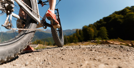Photo bottom of woman on bicycle