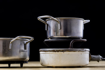 Electric razor for cooking lunch and water for tea. Old kitchen accessories on an old heater.
