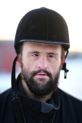 Down syndrome man with horse. Hippotherapy