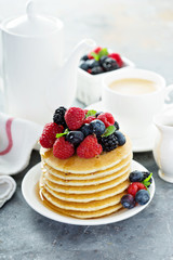 Stack of buttermilk pancakes with fresh berries