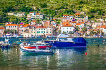 Fototapeta na wymiar Vis island landscape seascape. / Seafront view at coastal town Vis in Southern Croatia, famous sailing travel destination in Mediterranean.