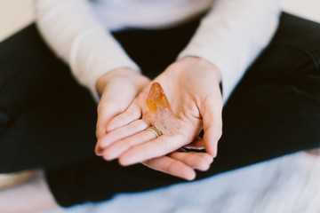 woman holding a crystal