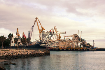 Fototapeta premium Cargo cranes in the dock of the industrial port.Spain, Cadiz, February 2018.