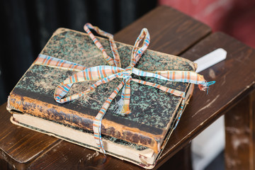 the old book in the cover is on the table