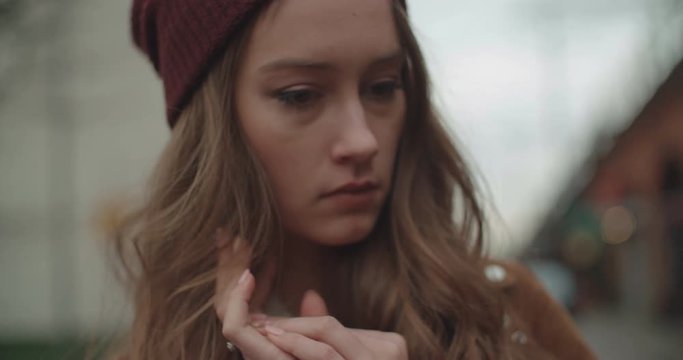 Beautiful Sad Anxious Woman Standing In A City Street.