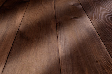 Brown wooden background with a sunlight close-up