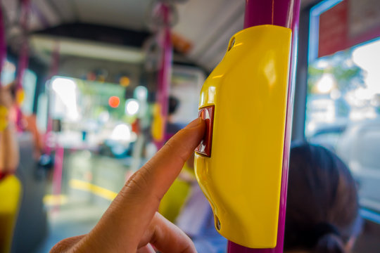 Close Up Of Selective Focus Of A Hand Pushing A Bus Stop Button Inside Of The Bus, Public Transport In Singapore