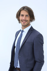 picture of a business man while holding both hands in pockets