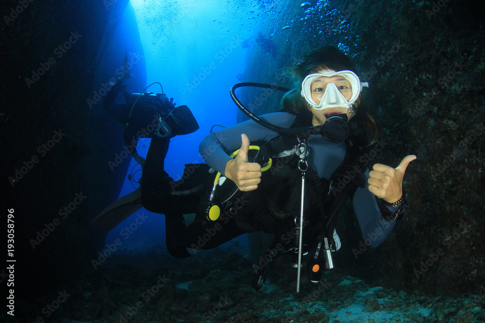 Canvas Prints Scuba dive. Young Asian woman scuba diving