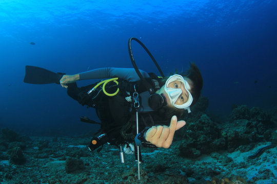Scuba dive. Young Asian woman scuba diving