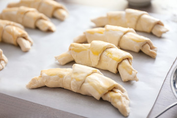 Raw croissants on table