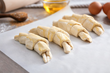 Raw croissants on table
