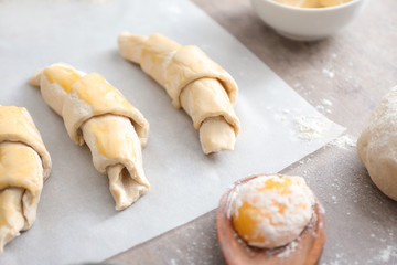 Raw croissants on table
